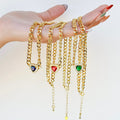 Dainty gold layered necklace, wholesale jewelry for women's boutiques, statement accessory, boutique wholesale jewelry, waterproof necklaces, statement gold necklace, trendy gold jewelry, hypoallergenic jewelry, tarnish-free necklace, gold chunky chain necklaces with blue, red, and green heart-shaped gemstone pendants
