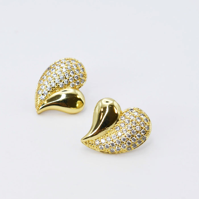 gold heart stud earrings, crystal pavé design, asymmetrical heart shape, shiny gold finish, hypoallergenic, tarnish free, waterproof jewelry, trendy boutique earrings, wholesale earrings for boutique