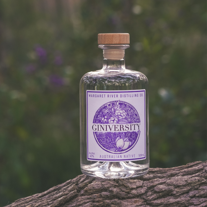 Giniversity Australian Native 500ml bottle on a log