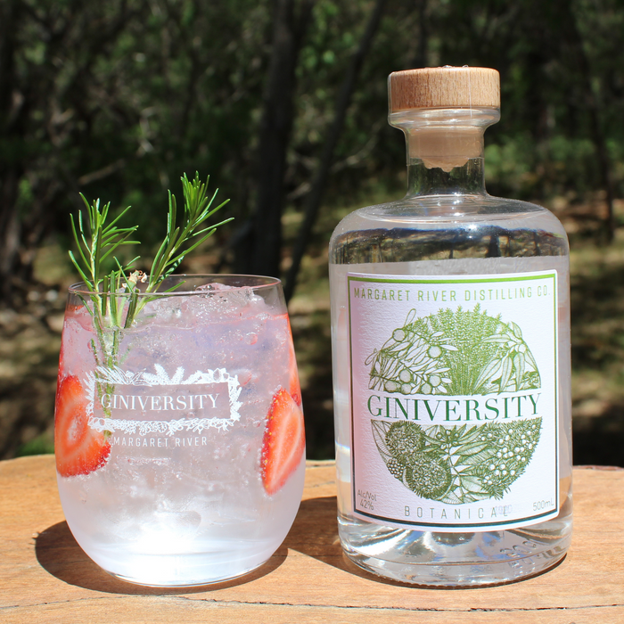 Giniversity gin glass with a G&T next to a Botanical Gin 500ml. Glass features Giniversity logo and Margaret River printed in white