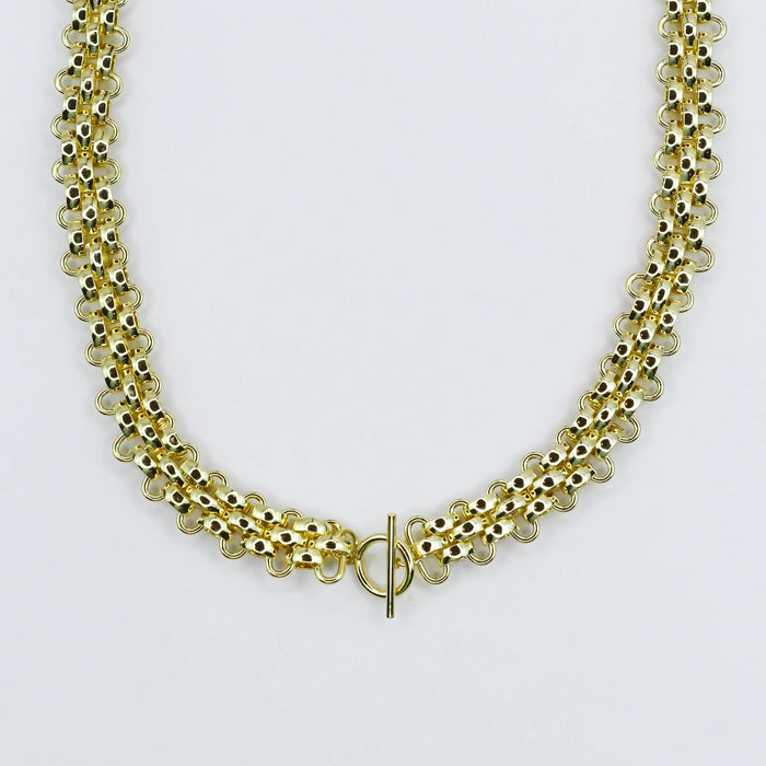 Dainty gold layered necklace, boutique wholesale jewelry, waterproof gold necklace, hypoallergenic and tarnish free statement accessory featuring a gold chain necklace with textured links and a front toggle clasp