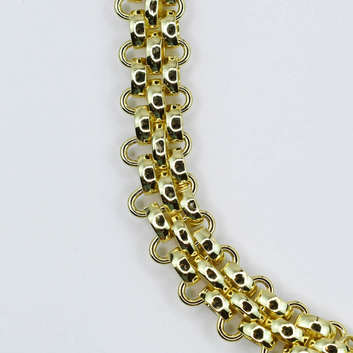 Dainty gold layered necklace, boutique wholesale jewelry, waterproof gold necklace, hypoallergenic and tarnish free statement accessory featuring a gold chain necklace with textured links and a front toggle clasp