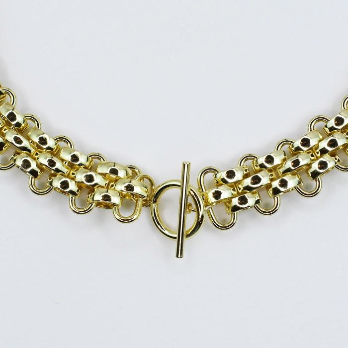 Dainty gold layered necklace, boutique wholesale jewelry, waterproof gold necklace, hypoallergenic and tarnish free statement accessory featuring a gold chain necklace with textured links and a front toggle clasp
