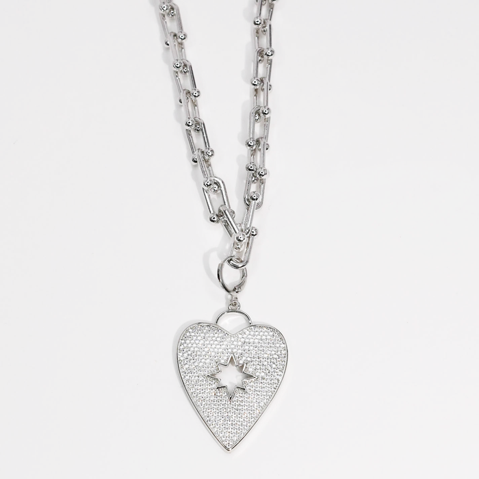 Dainty necklace with heart-shaped pendant in silver, encrusted with sparkling crystals, waterproof, hypoallergenic and tarnish-free, elegant and trendy accessory for women’s boutique jewelry