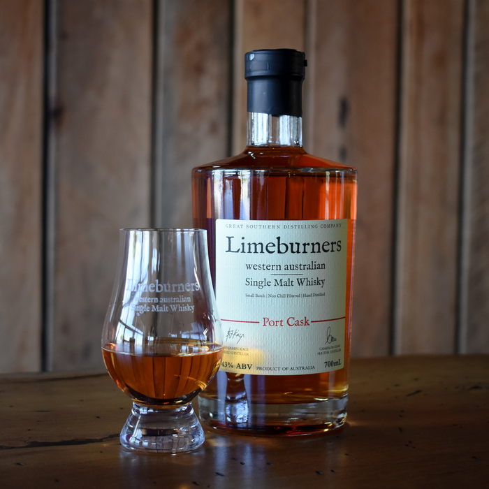 Limeburners Whisky glass with Limeburners logo printed in an etch effect next to a Limeburners Port Cask 700ml bottle
