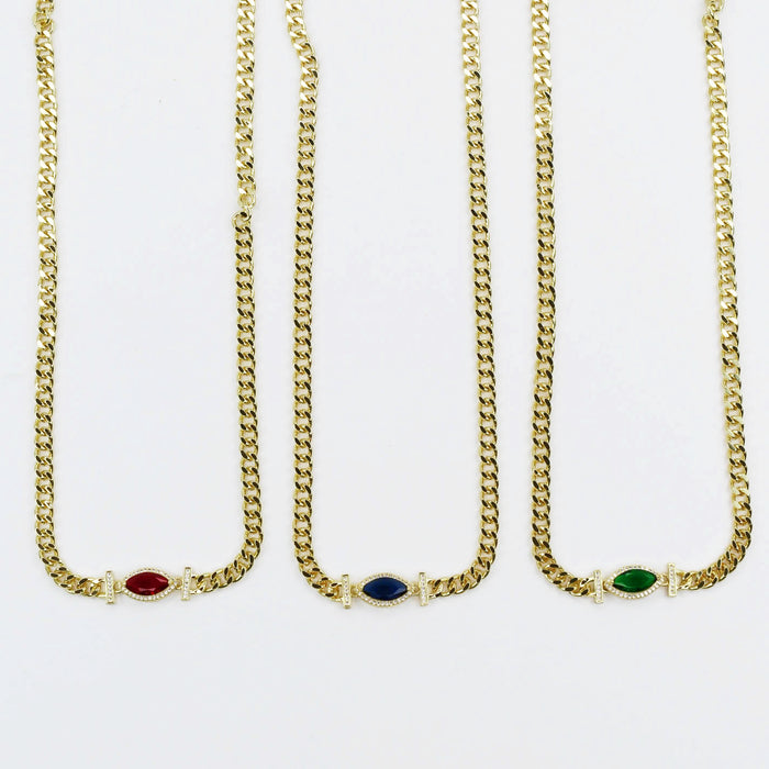 Dainty gold layered necklace, wholesale jewelry for women's boutiques, statement accessory, boutique wholesale jewelry, waterproof necklaces, statement gold necklace, trendy gold jewelry, hypoallergenic jewelry, tarnish-free necklace, gold chunky chain necklaces with red, blue, and green marquise gemstone accents and rhinestone details