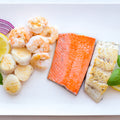 Selection of paleo fish including Wild Sockeye Salmon Fillet, Deveined shrimp, scallops and north atlantic haddock