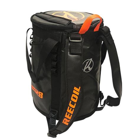 A black REECOIL rope bag with bright orange accents, including the brand name printed vertically on the front and a top carry loop, shown on a plain white background.