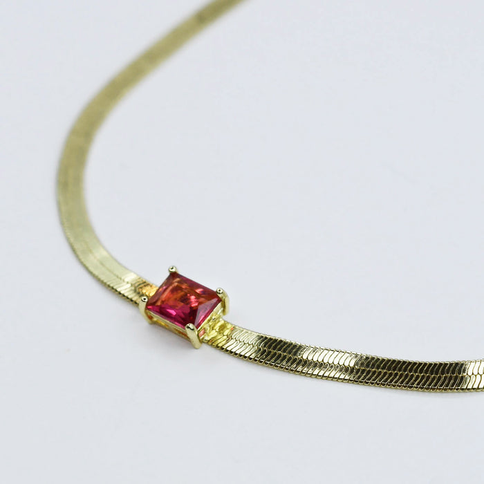 Gold necklace with a ruby square gemstone pendant, boutique wholesale jewelry for women, trendy minimalist accessory, waterproof and hypoallergenic necklace, tarnish-free gold chain, elegant ruby gemstone choker for stylish women’s boutiques