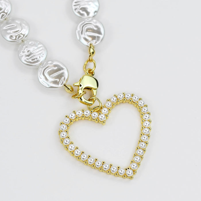 Dainty gold layered necklace heart pendant with pearl details for wholesale jewelry for women's boutiques statement accessory waterproof necklaces boutique wholesale jewelry trendy hypoallergenic tarnish free