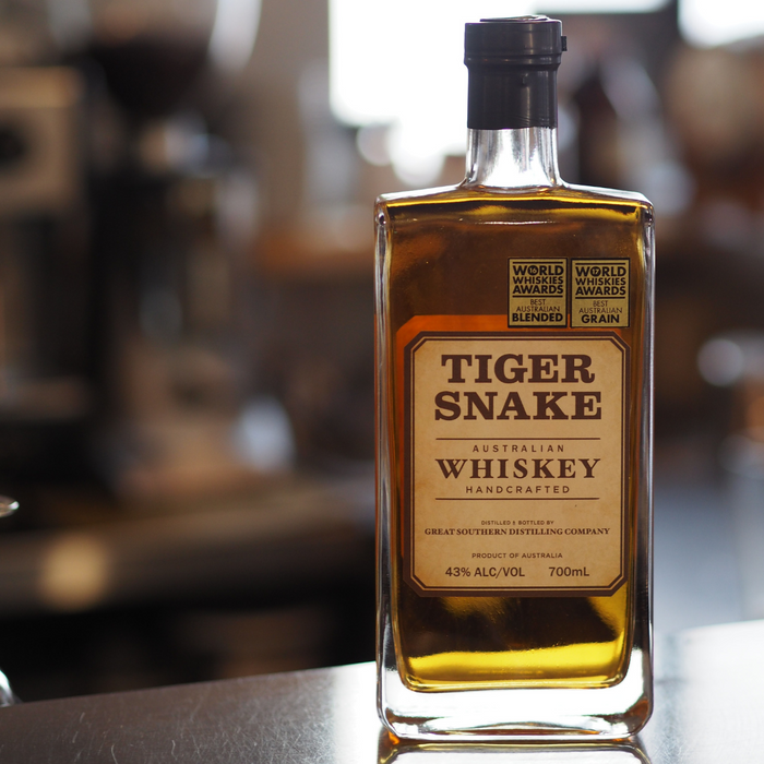 Tiger Snake Whiskey 700ml bottle on a steel surface