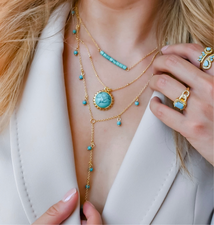 Layered gold turquoise necklace set with beaded accents, boutique wholesale jewelry for women, trendy boho statement accessory, waterproof and hypoallergenic layered necklaces, tarnish-free gold chains, turquoise pendant necklace for stylish women’s boutiques