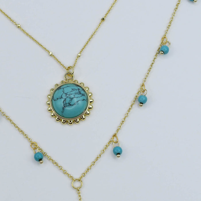 Layered gold turquoise necklace set with beaded accents, boutique wholesale jewelry for women, trendy boho statement accessory, waterproof and hypoallergenic layered necklaces, tarnish-free gold chains, turquoise pendant necklace for stylish women’s boutiques